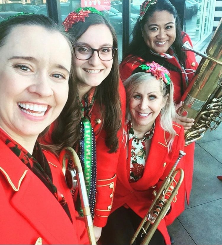 Belle Air Brass four women in red holiday uniforms